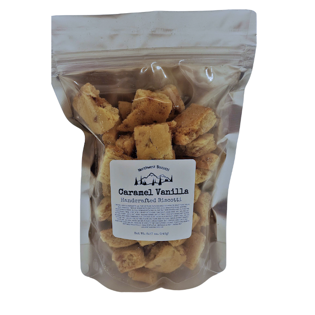 A clear resealable bag contains bite-size Caramel Vanilla Biscotti Bites. Labeled as handcrafted by Northwest Biscotti, these light brown, chunky treats are perfect for fans of soft biscotti.