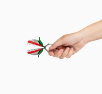 Thumbnail for A hand holds the OTOTO Studio Steep Fiend, a playful red and white Venus flytrap-shaped tea infuser with green leaves, perfect for brewing loose leaf tea against a plain white background.