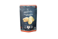 Thumbnail for A pouch of Chili Lime Saffron Pistachiosš¶ļø ā Spicy, Tangy & Totally Addictive, showcased with an image of fiery snacks on a dark blue background decorated with leaves and product details on the front.