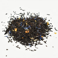 Thumbnail for A small pile of Earl Grey’s Anatomy Loose Leaf Tea ☕ with blue and yellow flower petals and orange pieces, displayed on a white background.