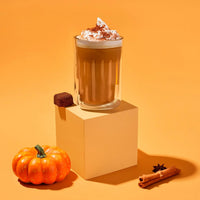 Thumbnail for A Pumpkin Spice Tea Drop – Cozy Up to Fall in a Cup 🎃☕🍂 sits on a beige cube, surrounded by a small pumpkin, cinnamon sticks, star anise, brown sugar, and Pumpkin Pie Spices against an orange background.
