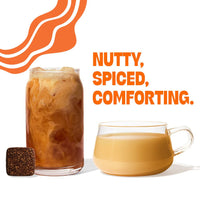Thumbnail for A glass of iced coffee and a clear mug of coffee sit beside a Pumpkin Spice Tea Drop—bold orange text reads Nutty, Spiced, Comforting—infused with pumpkin pie spices and set against abstract orange lines in the background. Cozy up to fall in a cup!.