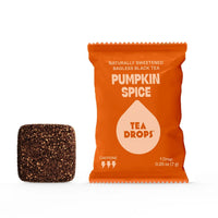Thumbnail for A Pumpkin Spice Tea Drop – Cozy Up to Fall in a Cup 🎃☕🍂 orange packet stands upright beside a brown tea drop cube. Made with Organic Black Tea and Pumpkin Pie Spices, it contains caffeine, natural sweetness, and one tea drop.