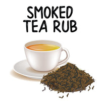Thumbnail for A white teacup filled with tea sits on a saucer beside dark Lapsang Souchong leaves. Above them, bold black letters spell out āSmoked Tea Rub š„,ā hinting at the productās rich, smoky flavor.
