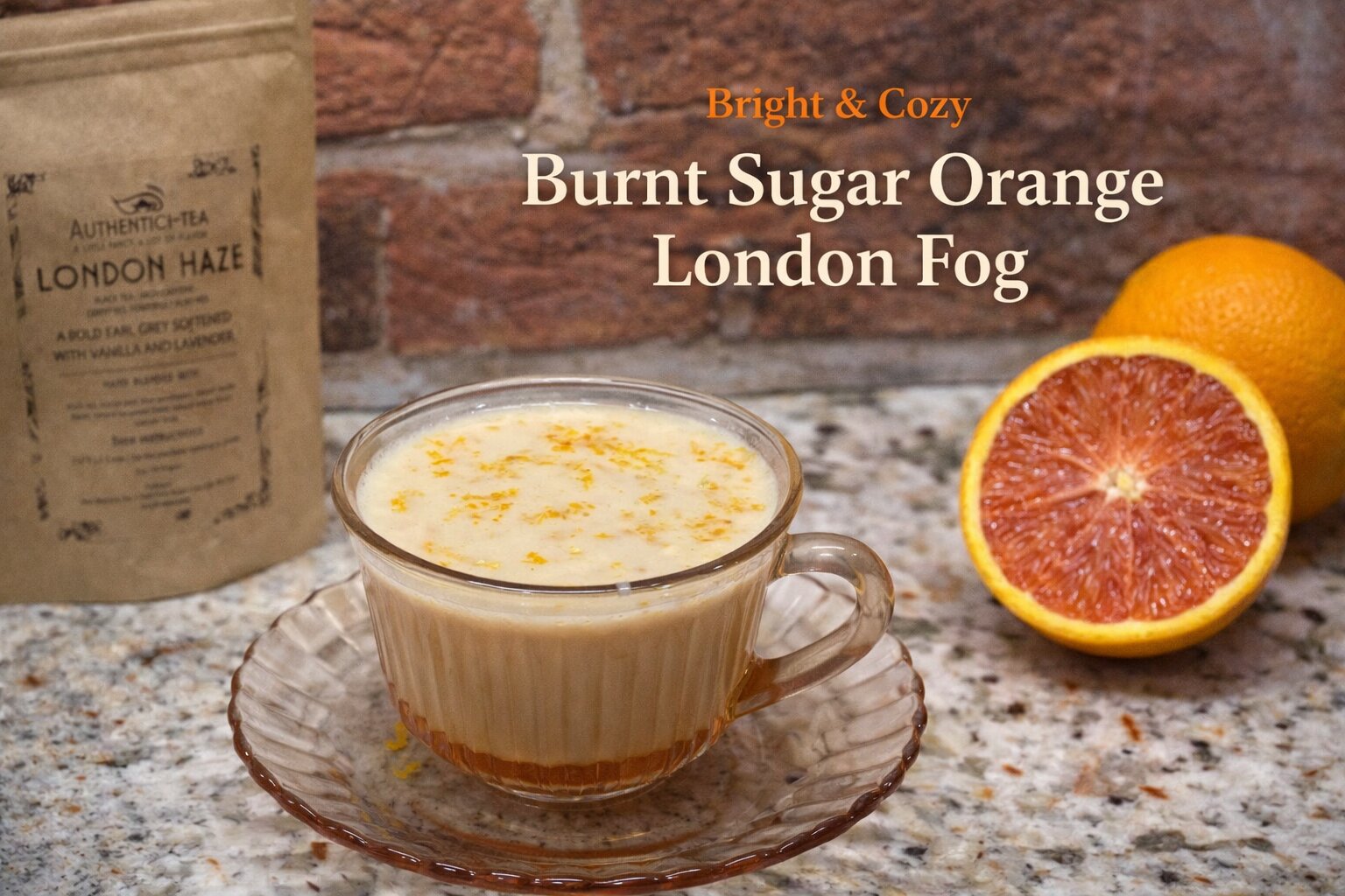 Horizontal image of Burnt Sugar Orange London Fog in a glass cup with orange zest on top, styled with London Haze tea packaging and a halved blood orange against a brick background, with text overlay.