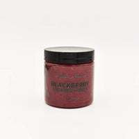 Thumbnail for A jar of Nate’s Nectar Blackberry Creamed Honey – Berry Sweet & Spreadably Smooth with a black lid sits on a plain white background. The dark purple honey resembles blackberry jam. The jar contains 8.5 oz (255g) of raw honey.