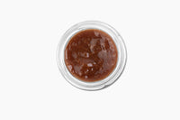 Thumbnail for Top view of a small glass jar from the Mini Tea Jams Gift Set 🍯, filled with thick, brown, chunky gourmet tea-infused jam, placed on a white background.