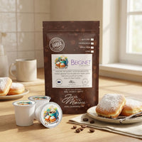 Thumbnail for Bag of Beignet coffee on a kitchen counter with white ceramic mugs.