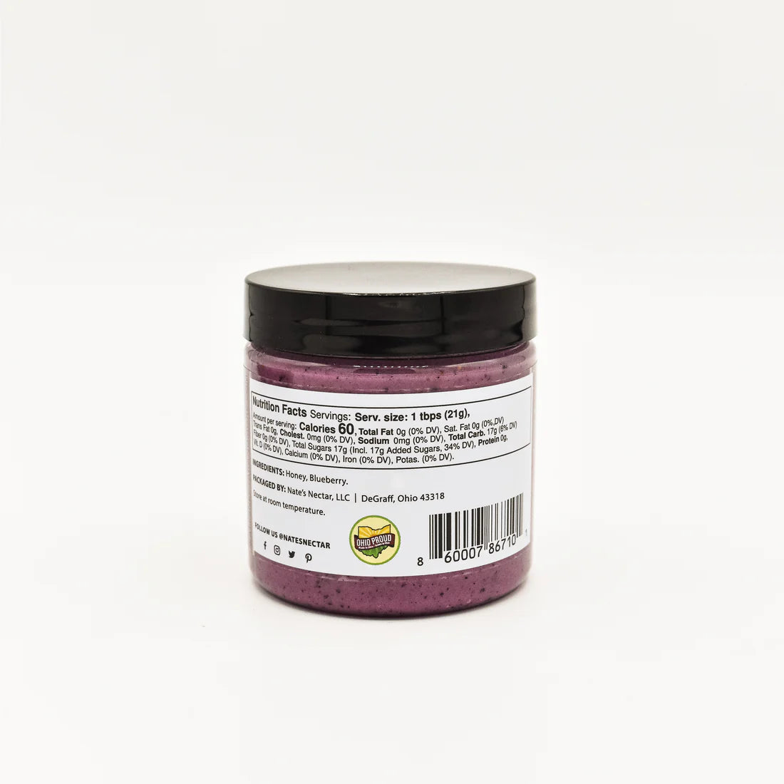 A jar of Nate’s Nectar Blueberry Creamed Honey 💙 with a black lid is displayed, showing its nutrition label with facts, ingredients, and a barcode at the bottom right.