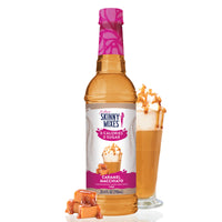 Thumbnail for A bottle of Caramel Macchiato Skinny Syrup – Barista Bliss in a Bottle ☕🍮✨ is displayed beside a tall caramel macchiato topped with whipped cream and caramel drizzle, with caramel candies arranged at the base.