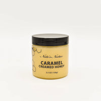 Thumbnail for Nate’s Nectar Caramel Creamed Honey 🍯 – Sweet, Buttery Bliss in a Jar comes in a 5.5 oz (156g) jar with a black lid, yellow label, and honeycomb design, made from raw natural honey and photographed on a plain white background.