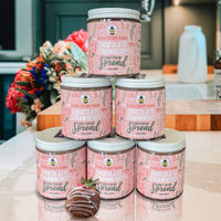 Thumbnail for Six jars of Chocolate Strawberry Honey Cream Spread 🍓 – A Decadent Twist on a Classic Duo are stacked in a pyramid on a kitchen counter, with a chocolate-dipped strawberry in front and blurred wildflower honey-inspired flowers behind.