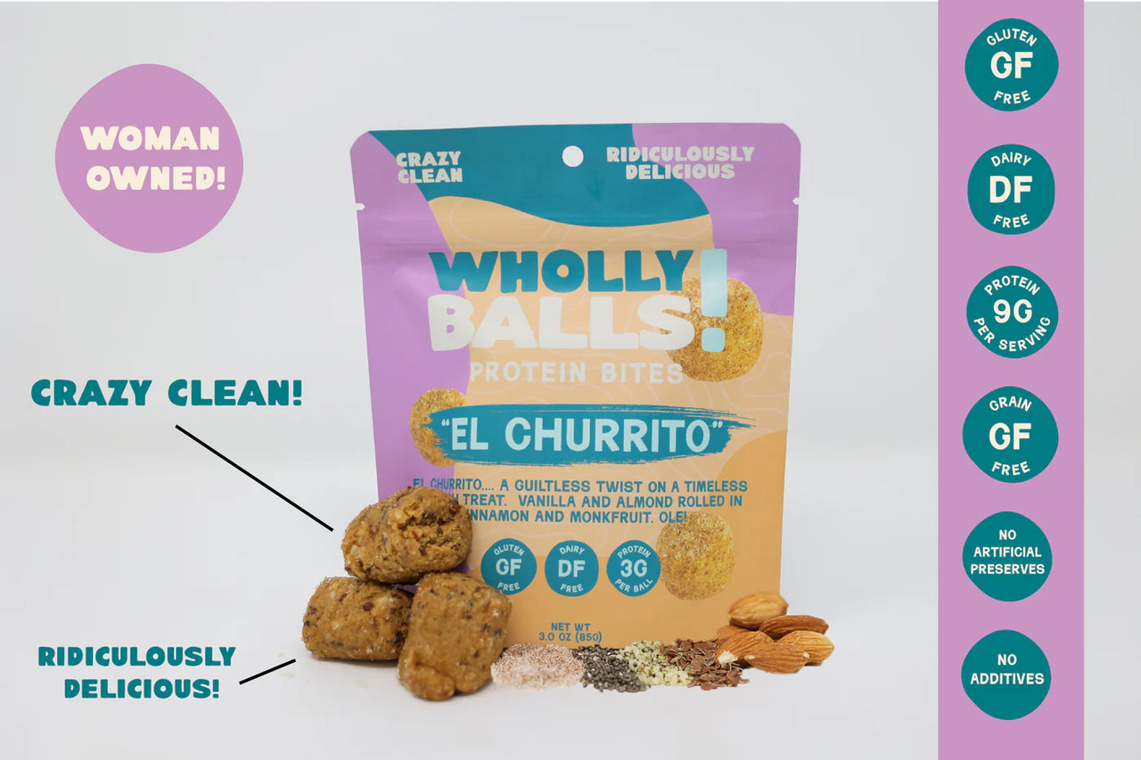 A vibrant bag of El Churrito – Vanilla Cinnamon Almond Wholly Balls, a plant-based protein snack, stands upright with bites, nuts, and seeds in front. Crazy Clean! and Ridiculously Delicious! callouts and feature badges are visible.