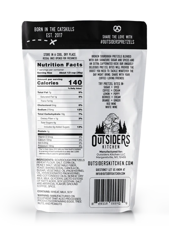 A silver bag of Outsiders Coffee + Cream Pretzel Bites – Sweet, Salty, and Seriously Addictive ☕✨ is shown from the back, displaying nutrition facts, ingredients, brand story, website info, and social media details in black text.