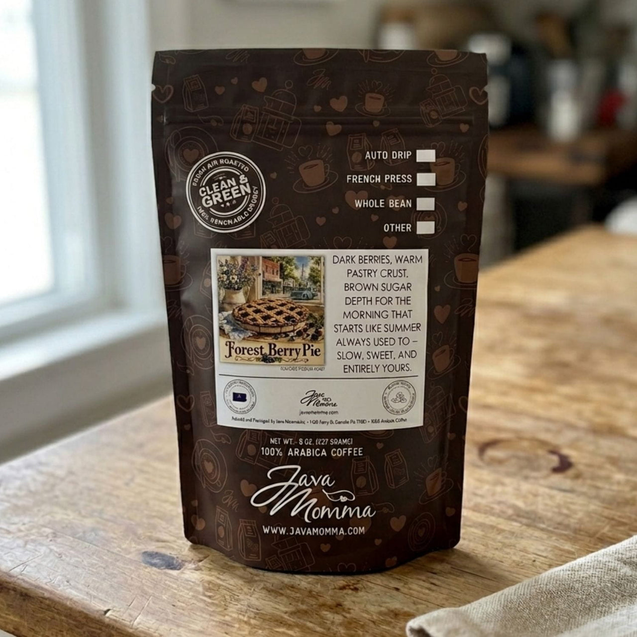 Java Momma Forest Berry Pie 
coffee package on a wooden surface with a blurred background