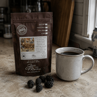 Thumbnail for Java Momma Forest Berry pie coffee package with a mug of coffee on a rustic surface