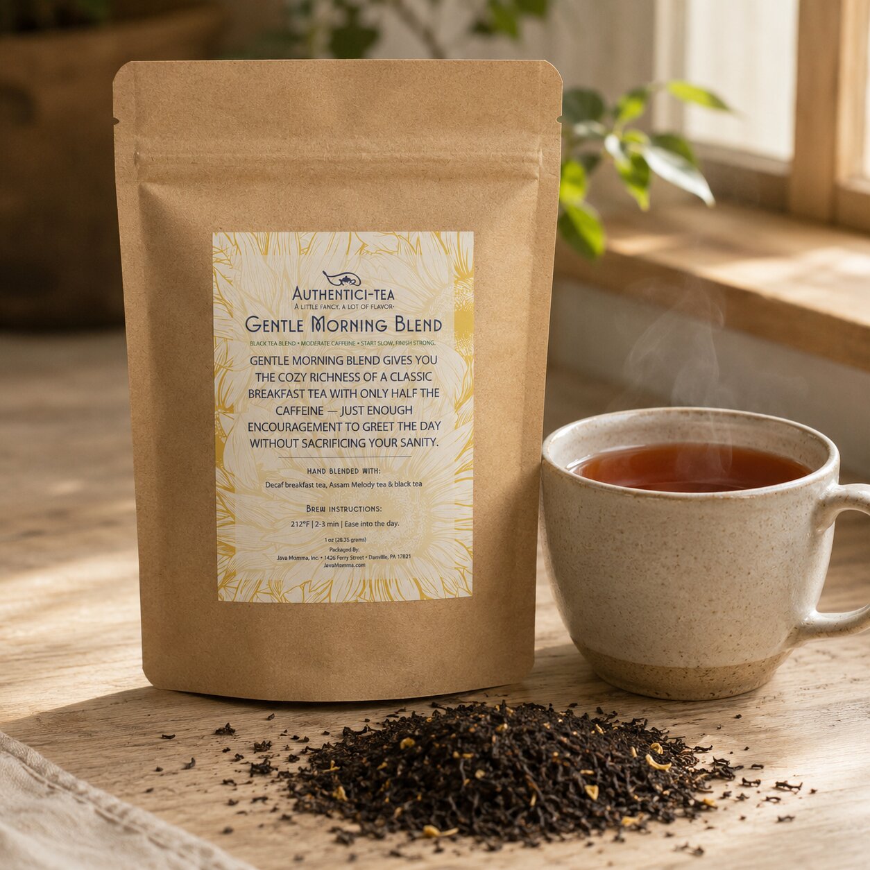 Tea package labeled 'Gentle Morning Blend' with a steaming cup of tea on a wooden surface.