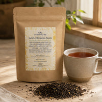 Thumbnail for Tea package labeled 'Gentle Morning Blend' with a steaming cup of tea on a wooden surface.
