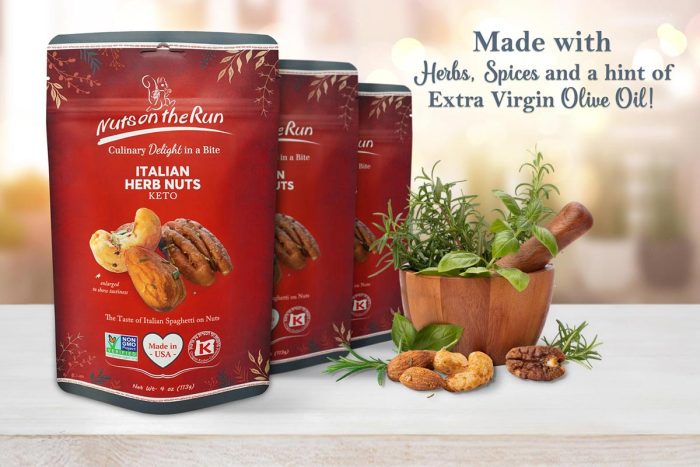 Three red bags of Nuts on the Run Italian Herb Nuts Keto are displayed on a light wooden surface next to a wooden mortar and pestle with herbs, cashews, and pecans, with text reading 'Made with Herbs, Spices and a hint of Extra Virgin Olive Oil!'.