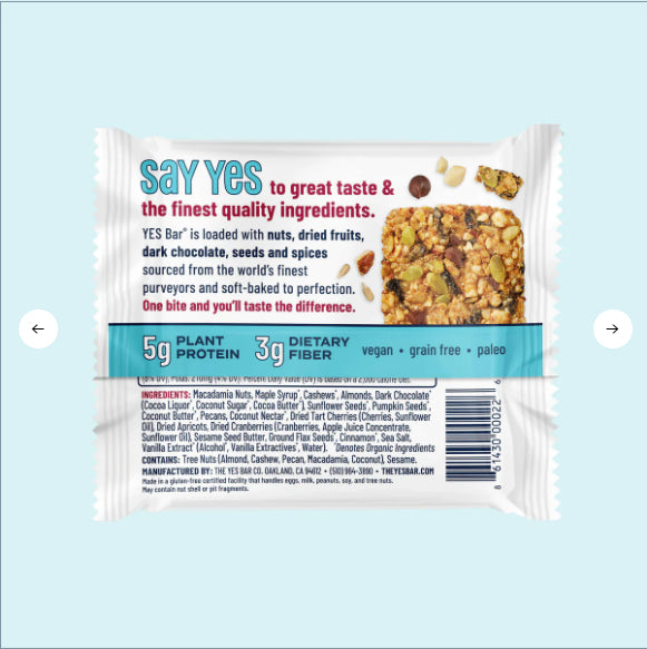 The Macadamia Chocolate YES Bar®—the OG flavor that started it all—is a plant-based snack packed with nuts, dried fruits, dark chocolate, plant protein, and fiber. Its white, gluten-free wrapper showcases key product info and ingredients.