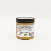 Thumbnail for A small jar with a black lid, shown from the back, displays nutrition facts and ingredients for Nate’s Nectar Maple 🍁 Creamed Honey – Cozy, Sweet & Spreadably Smooth. A barcode appears at the bottom.