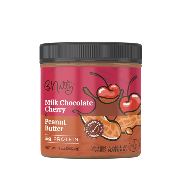 A jar of Milk Chocolate Cherry Peanut Butter 🍒 – Fruity, Chocolatey, and Sinfully Smooth—made with honey roasted peanuts. The label shows dark cherries & chocolate, highlights 5g protein, all natural, gluten free, and women-owned business.