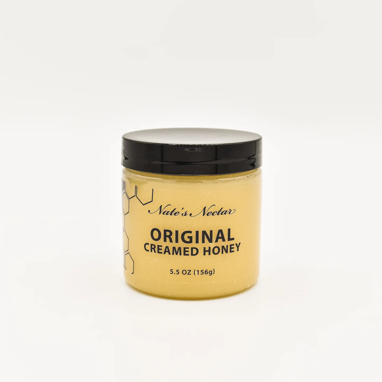 A 5.5 oz jar of Nate’s Nectar Original Creamed Honey 🐝 – Pure, Spreadable Bliss in a Jar, with a black lid and minimal honeycomb label, filled with smooth honey and set against a plain white background.