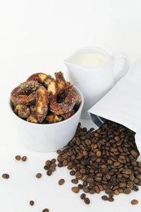 Thumbnail for A white bowl of Coffee + Cream Pretzel Bites – Sweet, Salty, and Seriously Addictive ☕✨ sits beside spilled coffee beans and a milk pitcher, making the perfect small batch snack for coffee lovers.