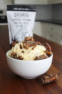Thumbnail for A white bowl of vanilla ice cream with Coffee + Cream Pretzel Bites – Sweet, Salty, and Seriously Addictive ☕✨ sits on a wooden counter. In the background is the bag, perfect for fans of unique small batch snacks.