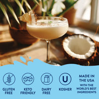 Thumbnail for A coupe glass holds a creamy coconut cocktail with Coconut Skinny Syrup – A Tropical Dream in Every Drop 🥥🏝️✨, garnished with pineapple and set by a halved coconut. Gluten-free, keto-friendly, dairy-free, kosher & made in the USA.