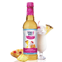 Thumbnail for A bottle of Pineapple Upside Down Cake Skinny Syrup – Dessert Meets Paradise 🍍🍰✨ stands beside a creamy drink topped with whipped cream, a cherry, and pineapple. Pineapple and cherry pieces appear in the foreground.
