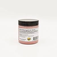 Thumbnail for A small jar of Nate’s Nectar Pomegranate Creamed Honey – Bold, Sweet & Irresistibly Smooth, with a black lid and pink honey inside. The back label details nutrition facts, ingredients, and company info. The jar sits on a plain white background.
