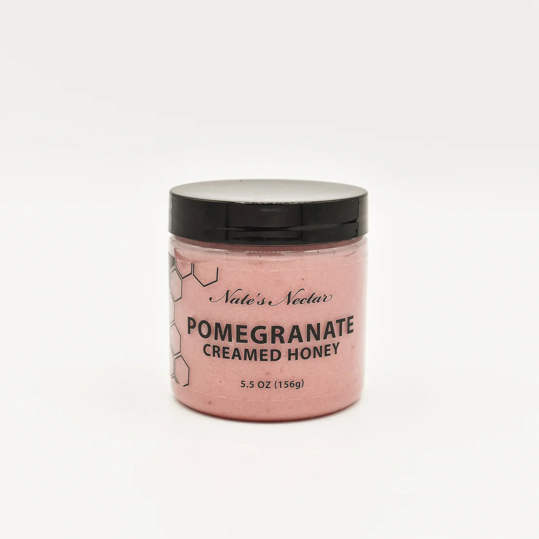 A 5.5 oz (156g) jar of Nate’s Nectar Pomegranate Creamed Honey – Bold, Sweet & Irresistibly Smooth features a black lid, pink creamed honey, and a simple hexagon-designed label, shown against a plain white background.