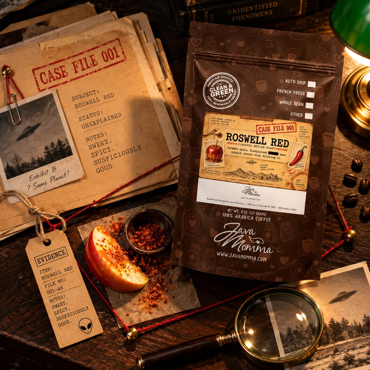 Roswell Red Coffee | Momma's Picks packaging with caramel apple, spices, and case file details on a wooden table.