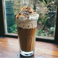 Thumbnail for A glass of iced coffee with whipped cream, caramel drizzle, and chocolate flakes sits by a window—made rich and keto-friendly with Salted Caramel Mocha Skinny Syrup: Sweet, Salty, and Totally Sippable ☕🍫✨.