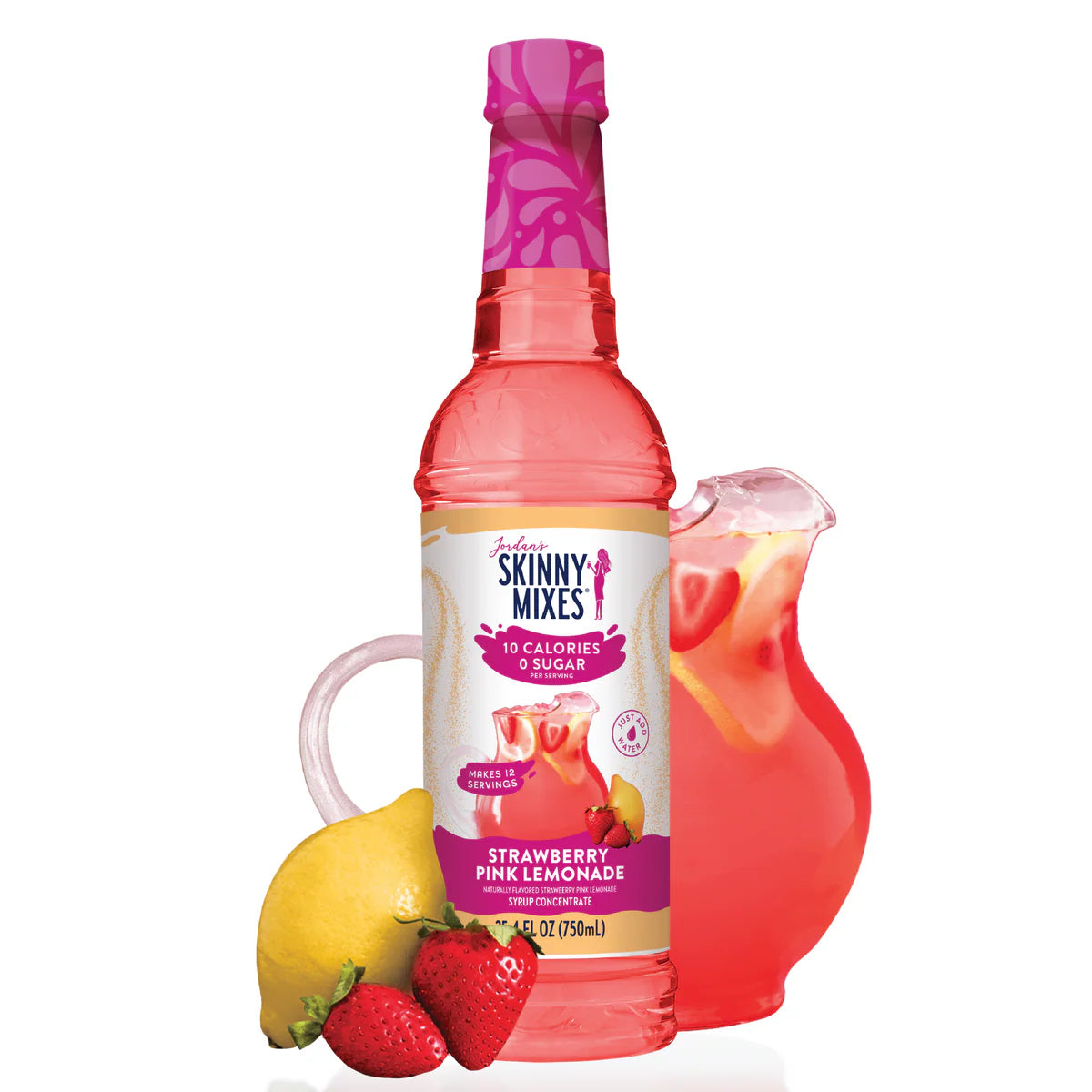 A bottle of Strawberry Pink Lemonade Concentrate – Sweet, Tart, & Totally Refreshing 🍓🍋✨ sits beside a glass pitcher of pink lemonade with lemon slices, a whole lemon, and strawberries—perfect for making a refreshing keto drink.
