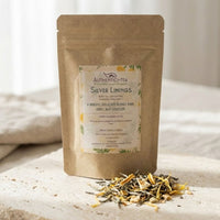 Thumbnail for Artisan tea bag with delicate white tea leaves scattered on a light surface in soft daylight