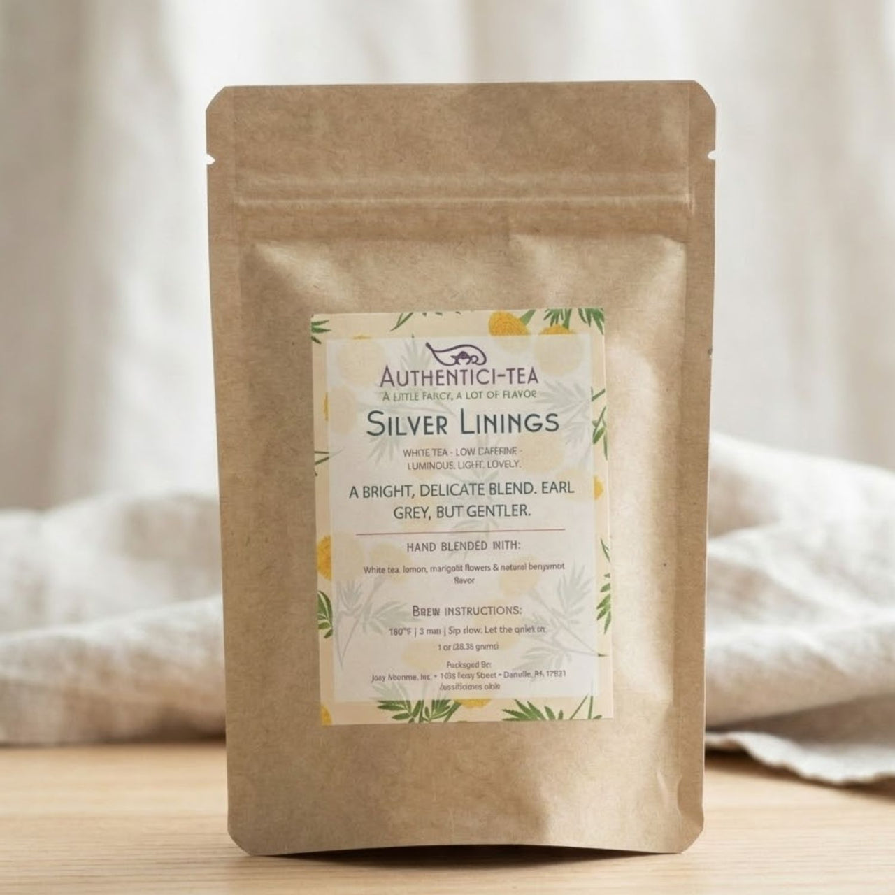 Tea package with 'Silver Linings' label on a neutral background