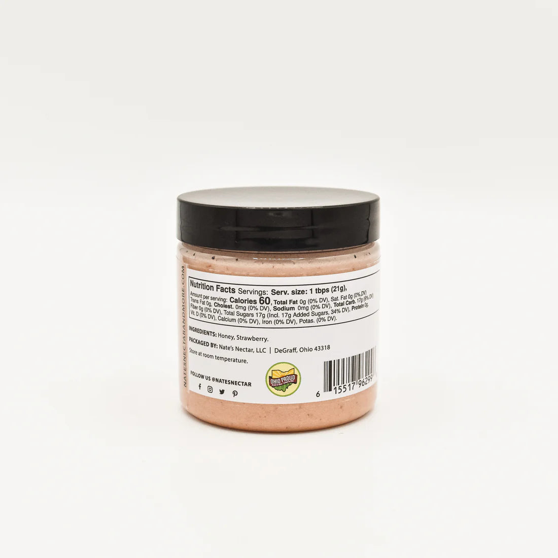 Nate’s Nectar Strawberry Creamed Honey 🍓 comes in a small jar with a black lid. The back label shows nutrition facts, ingredients, and company info in black text on a white background. Sweet, fruity, and ready to spread!.