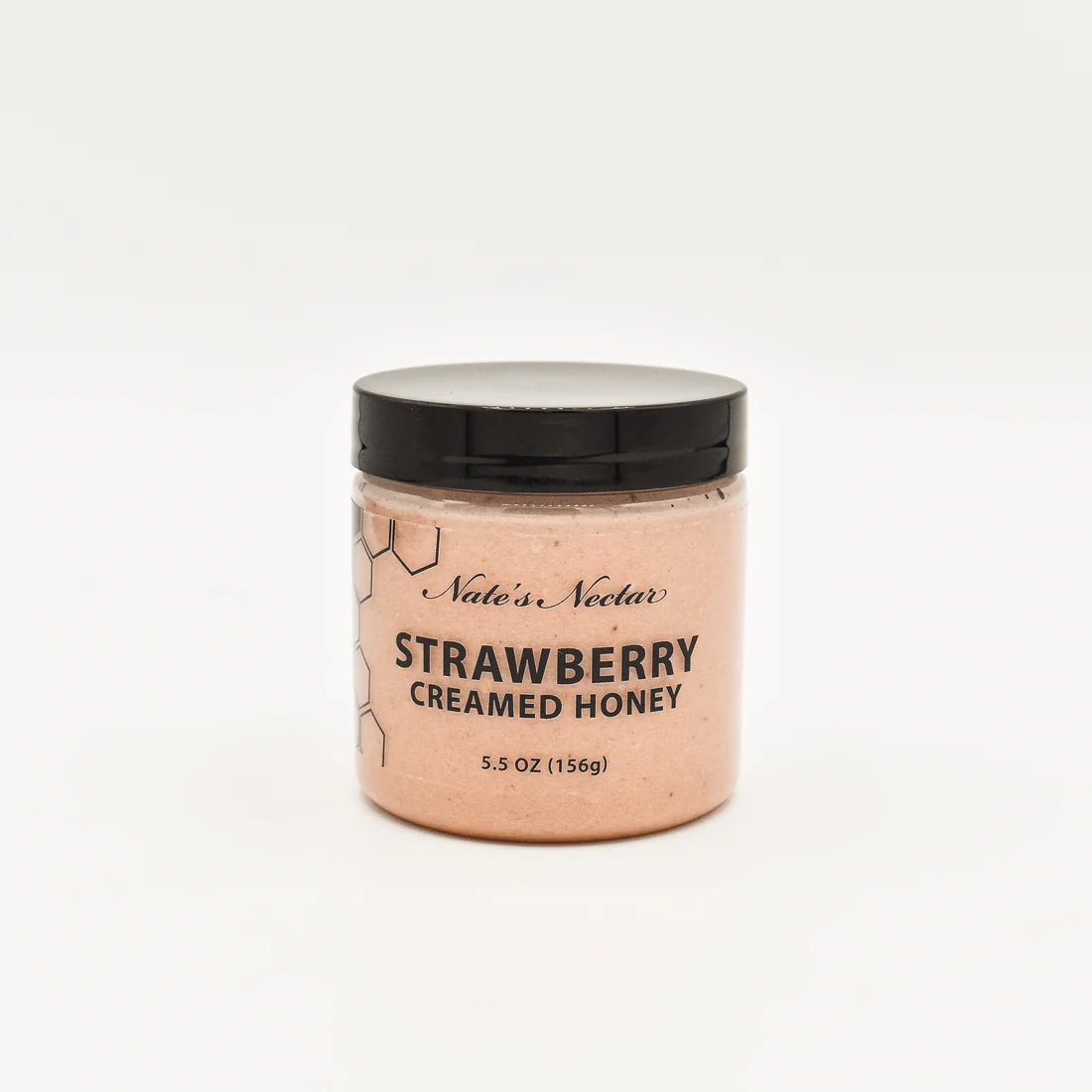 A jar of Nate’s Nectar Strawberry Creamed Honey 🍓 with a black lid and clear container showing pink honey, labeled in black text, is set against a plain white background.