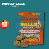 Thumbnail for A package of Breakfast Balls – Maple Peanut Butter Chocolate Chip Wholly Balls, a plant-based protein snack, is shown with several bites in front. The packaging highlights its maple peanut butter and chocolate chip flavors for breakfast.