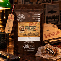 Thumbnail for Unidentified Fried Object Coffee | Momma's Picks 1/2 pound bag with deep-fried, chocolate cookie shape on display.