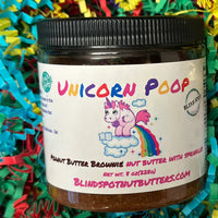 Thumbnail for Two jars of 'Unicorn Poop' peanut butter on colorful paper