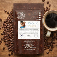 Thumbnail for Java Momma Back to Basics coffee package with coffee beans and a cup on a wooden surface