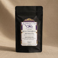 Thumbnail for Blood Orange Moon tea in Black tea package with a label on a beige background