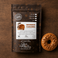 Thumbnail for Overhead flatlay of Bourbon Caramel Donut coffee bag with a caramel glazed donut topped with pecans