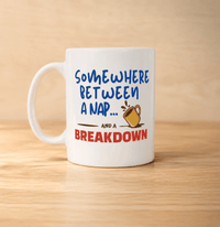 Thumbnail for White mug with humorous text design on a wooden surface - somewhere between a nap and a breakdown
