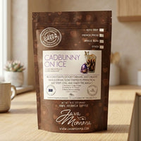 Thumbnail for Java Momma Cadbunny on Ice coffee package with product details on a wooden surface