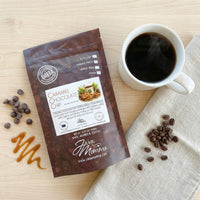 Thumbnail for Caramel Chocolate Chip Cookie coffee bag with mug of black coffee, chocolate chips, and caramel accents