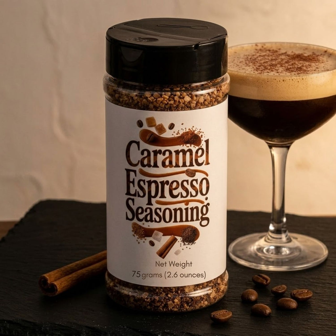 Caramel Espresso Seasoning bottle with a glass of coffee and cinnamon sticks on a dark surface.